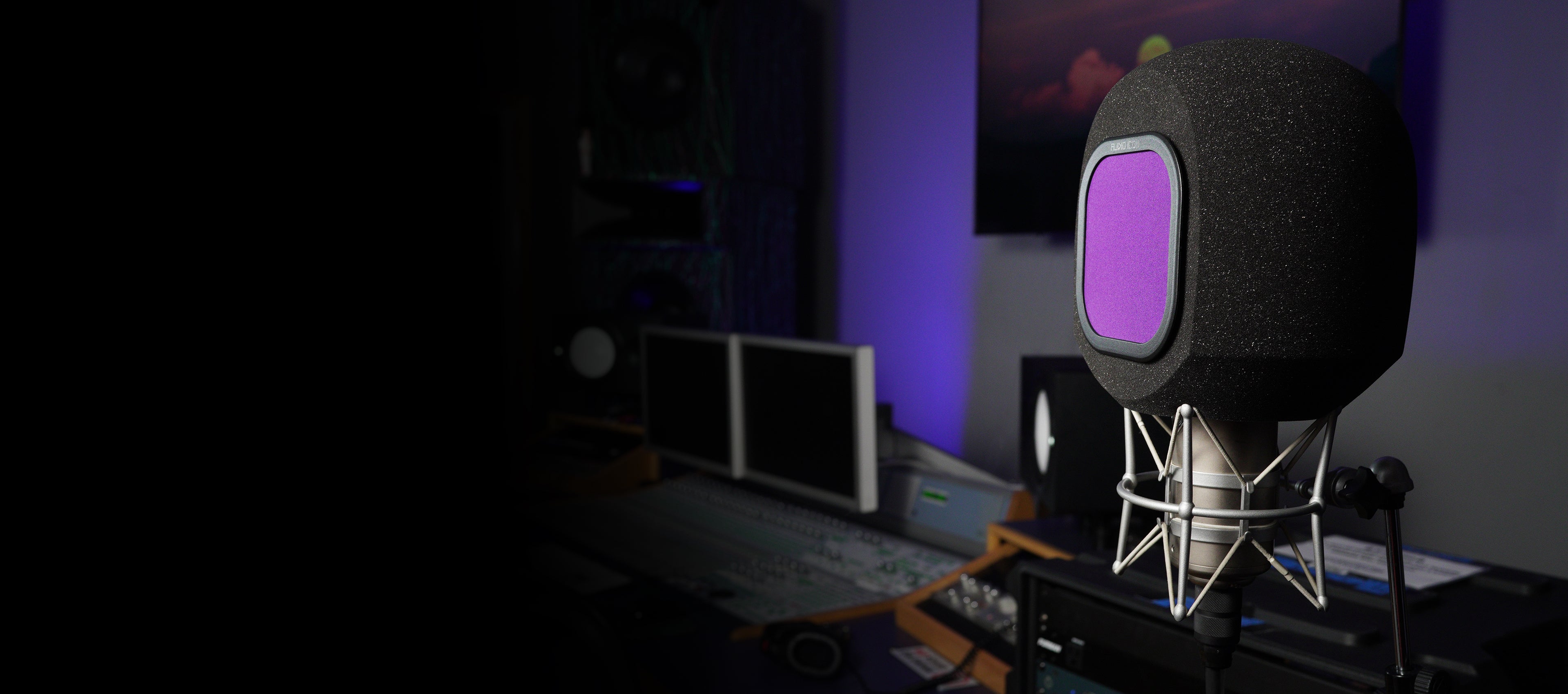 Microphone G90 SoundBox Isolation Booth with a purple pop filter in a studio setting